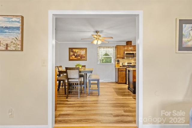 1792 Hoffman Rd, Gastonia, NC 28054 - dining area with light wood finished floors, ceiling fan, and crown molding