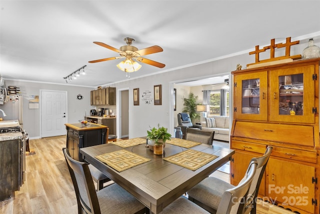 1792 Hoffman Rd, Gastonia, NC 28054 - dining space featuring ceiling fan, rail lighting, ornamental molding, and light wood-type flooring