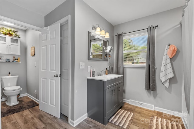 1792 Hoffman Rd, Gastonia, NC 28054 - bathroom featuring wood finished floors, toilet, vanity, and baseboards