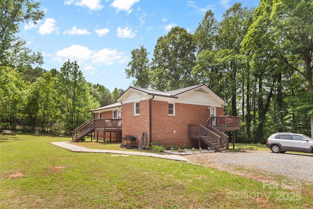 1792 Hoffman Rd, Gastonia, NC 28054 - view of side of home with stairs, brick siding, a wooden deck, and a yard