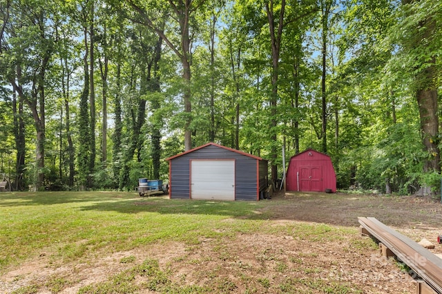 1792 Hoffman Rd, Gastonia, NC 28054 - view of green lawn with a storage unit, an outdoor structure, and a garage