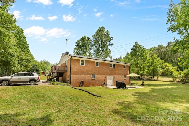 1792 Hoffman Rd, Gastonia, NC 28054 - view of side of home with stairs, brick siding, a lawn, a wooden deck, and a patio