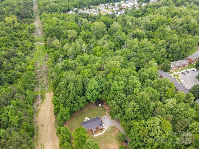 1792 Hoffman Rd, Gastonia, NC 28054 - aerial view of property and surrounding area featuring a heavily wooded area