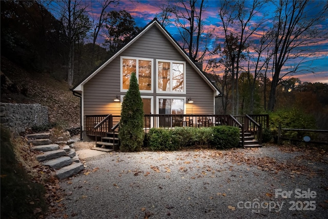 rear view of property with a wooden deck