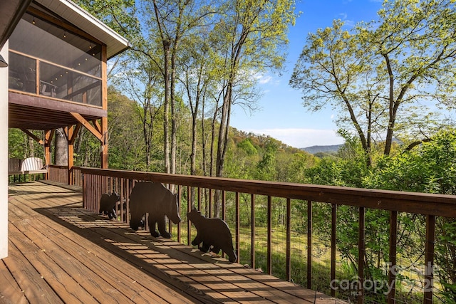 wooden terrace with a sunroom