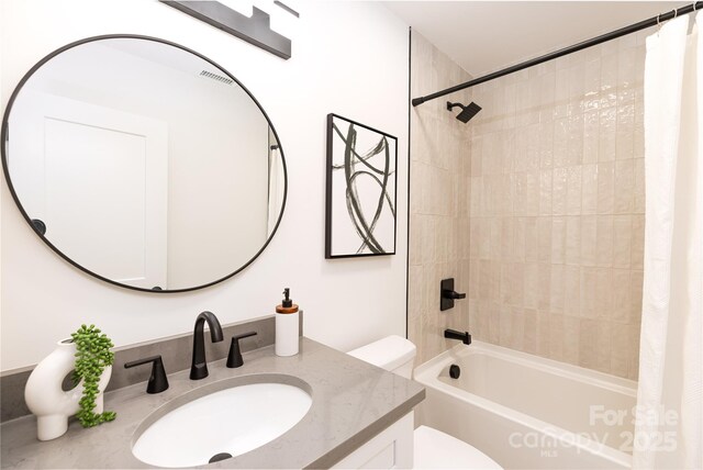 full bathroom with vanity, shower / bathtub combination with curtain, visible vents, and toilet