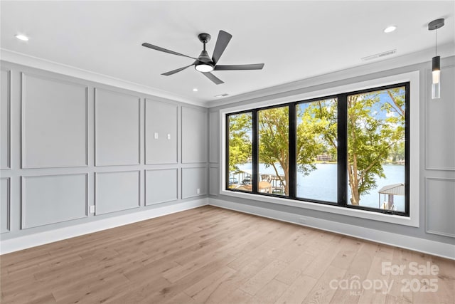 242 Shoreline Loop, Mooresville, NC 28117 - unfurnished room featuring a decorative wall, light wood-style flooring, ceiling fan, recessed lighting, and ornamental molding