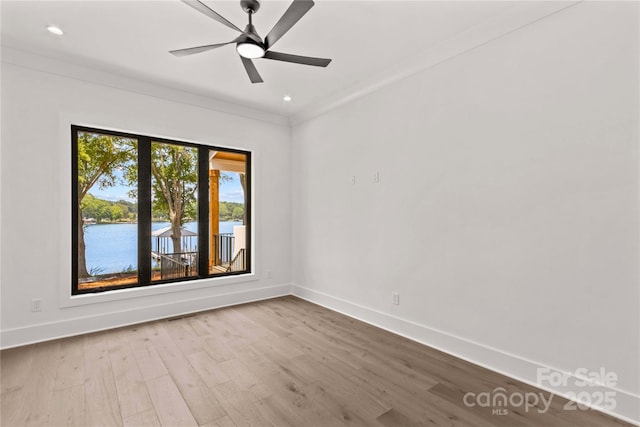 242 Shoreline Loop, Mooresville, NC 28117 - unfurnished room featuring wood finished floors, a water view, recessed lighting, ceiling fan, and crown molding