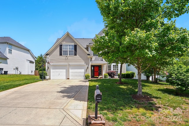 8833 Cavonnier Ln, Charlotte, NC 28216 - view of front of property with concrete driveway, a front lawn, and a garage