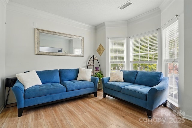 8833 Cavonnier Ln, Charlotte, NC 28216 - living room featuring crown molding, wood finished floors, and baseboards