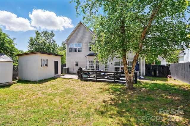 8833 Cavonnier Ln, Charlotte, NC 28216 - back of house with an outbuilding, central AC, a storage shed, a gate, and a deck