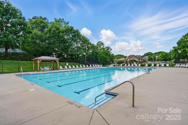 8833 Cavonnier Ln, Charlotte, NC 28216 - community pool featuring fence, a gazebo, a patio, and view of wooded area