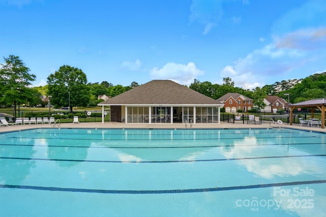 8833 Cavonnier Ln, Charlotte, NC 28216 - community pool featuring fence and view of scattered trees
