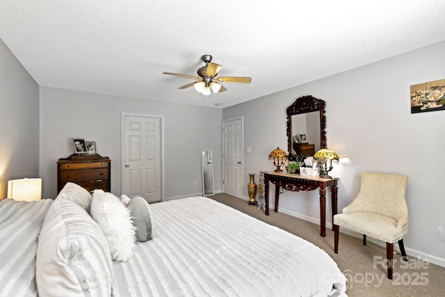 carpeted bedroom with baseboards and ceiling fan