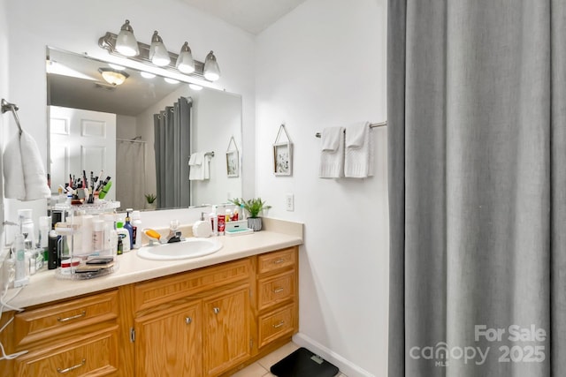 full bath featuring tile patterned flooring and vanity