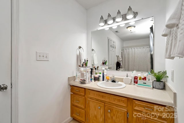 full bathroom with vanity and visible vents