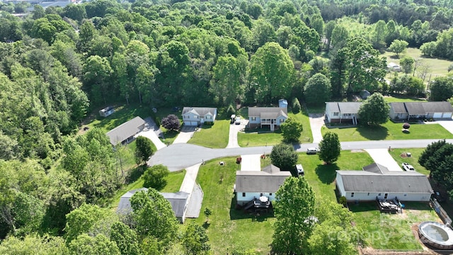 bird's eye view with a view of trees and a residential view