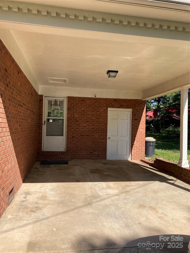 entrance to property with brick siding