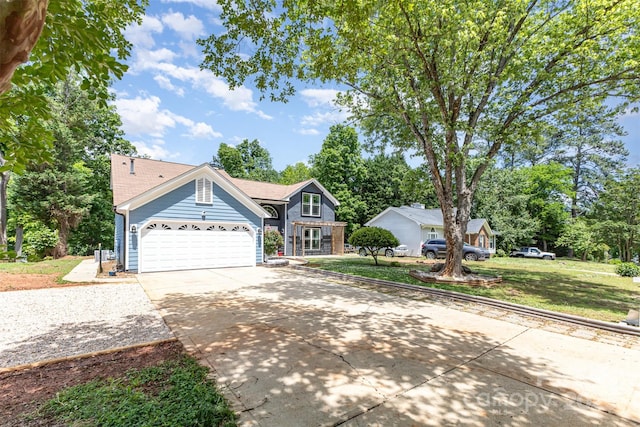traditional home featuring concrete driveway, a front lawn, and an attached garage