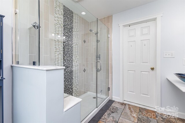 bathroom with a shower stall