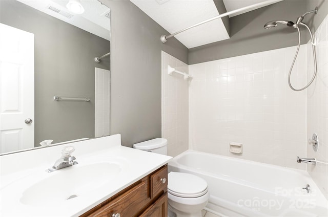 bathroom with toilet, shower / tub combination, and vanity