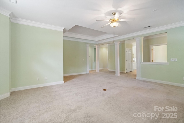 unfurnished room featuring crown molding, a ceiling fan, and ornate columns