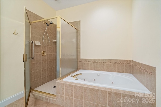 full bathroom with tile patterned floors, a tub with jets, and a stall shower