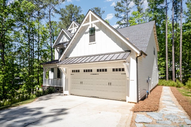 16432 Here At Last Ln, Charlotte, NC 28278 - exterior space featuring roof with shingles, a garage, board and batten siding, a standing seam roof, and driveway
