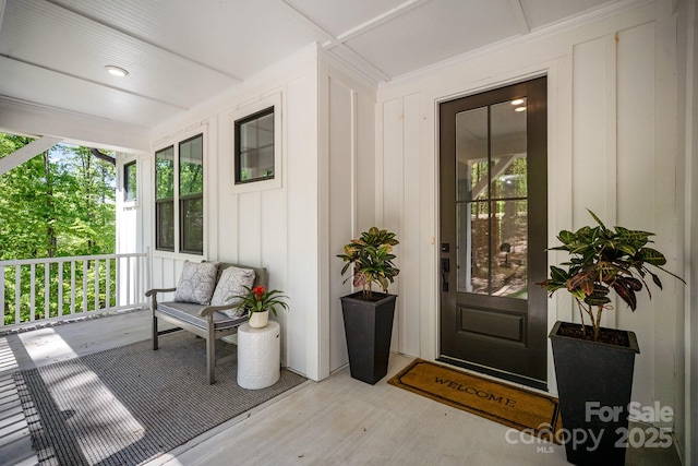 16432 Here At Last Ln, Charlotte, NC 28278 - view of exterior entry with a porch and board and batten siding