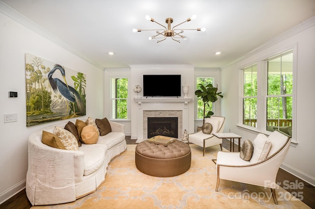 16432 Here At Last Ln, Charlotte, NC 28278 - living room featuring crown molding, a fireplace with flush hearth, baseboards, and a notable chandelier
