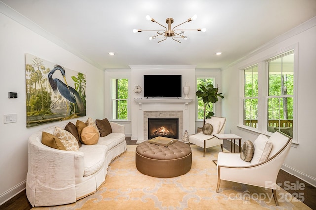 16432 Here At Last Ln, Charlotte, NC 28278 - living room featuring a lit fireplace, baseboards, an inviting chandelier, and ornamental molding