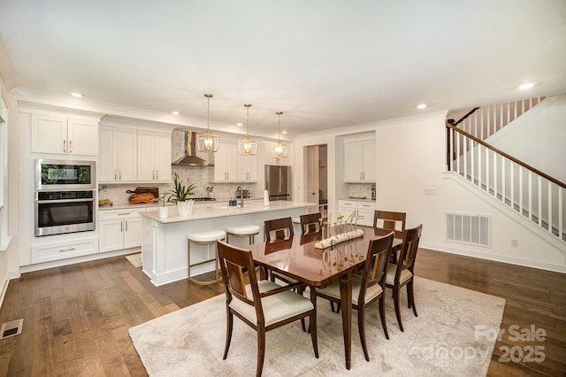 16432 Here At Last Ln, Charlotte, NC 28278 - dining space with recessed lighting, visible vents, dark wood finished floors, and stairway