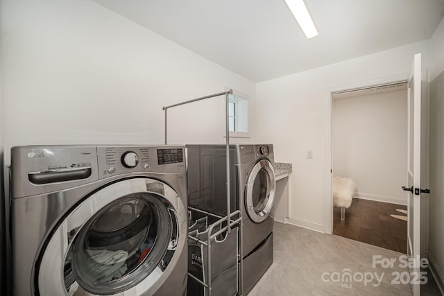 16432 Here At Last Ln, Charlotte, NC 28278 - clothes washing area featuring washing machine and clothes dryer, laundry area, and baseboards
