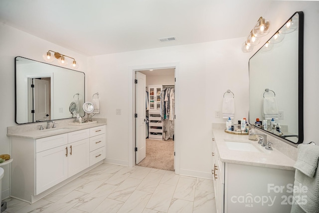 16432 Here At Last Ln, Charlotte, NC 28278 - bathroom with a sink, a spacious closet, two vanities, and marble finish floor