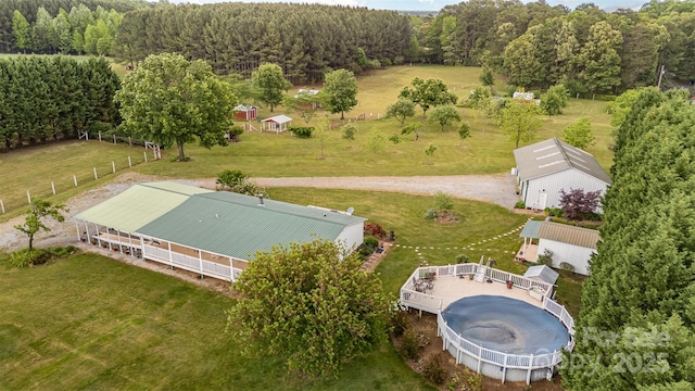 aerial view featuring a wooded view
