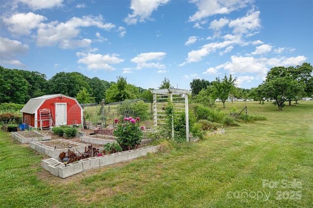view of yard with a shed, an outdoor structure, and a garden