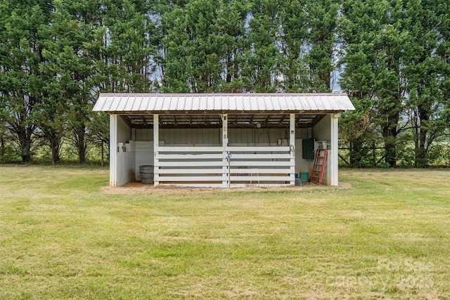 view of pole building with a lawn