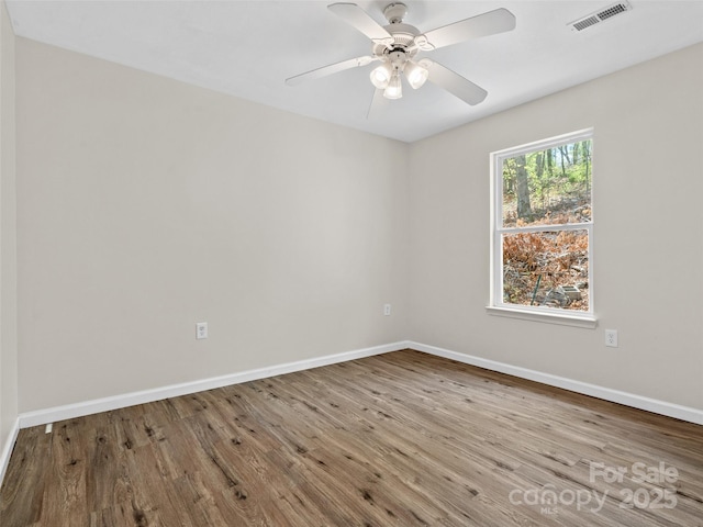 66 Avondale Heights Rd, Asheville, NC 28803 - unfurnished room featuring wood finished floors and a ceiling fan