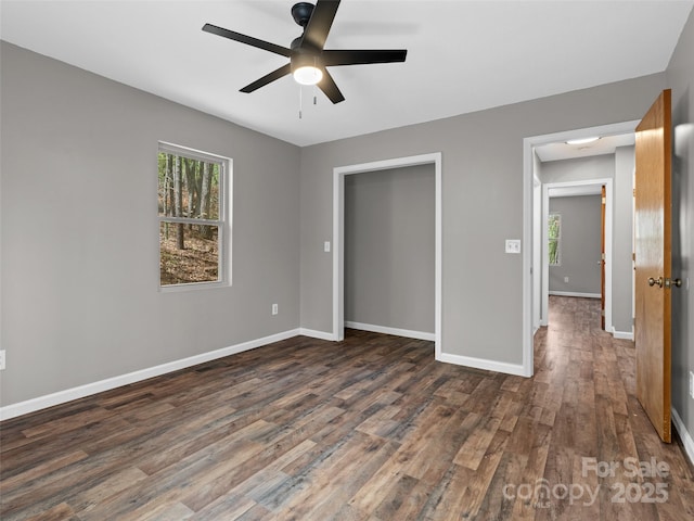 66 Avondale Heights Rd, Asheville, NC 28803 - unfurnished bedroom featuring dark wood-style floors, a ceiling fan, and a closet