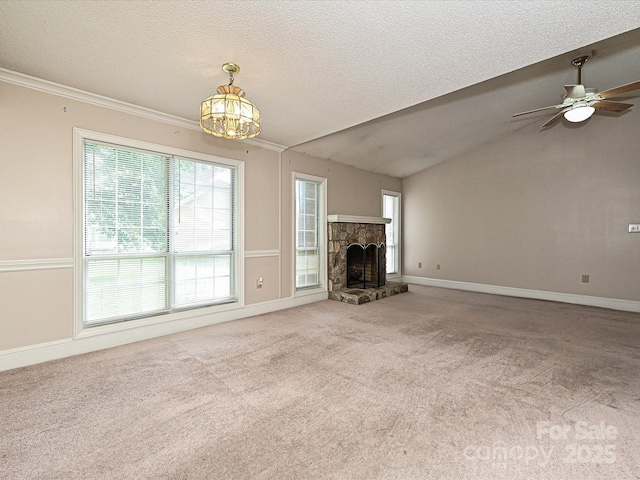 2919 Peachwood Ct, Fort Mill, SC 29715 - unfurnished living room with carpet floors, a stone fireplace, ceiling fan, a chandelier, and a textured ceiling