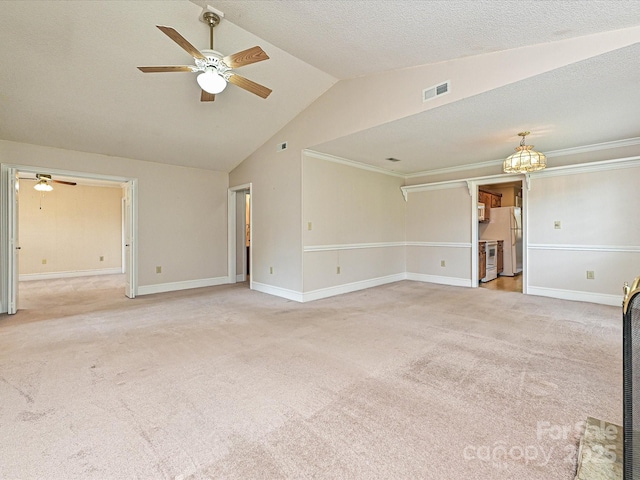 2919 Peachwood Ct, Fort Mill, SC 29715 - unfurnished living room featuring ceiling fan, light colored carpet, lofted ceiling, baseboards, and a chandelier