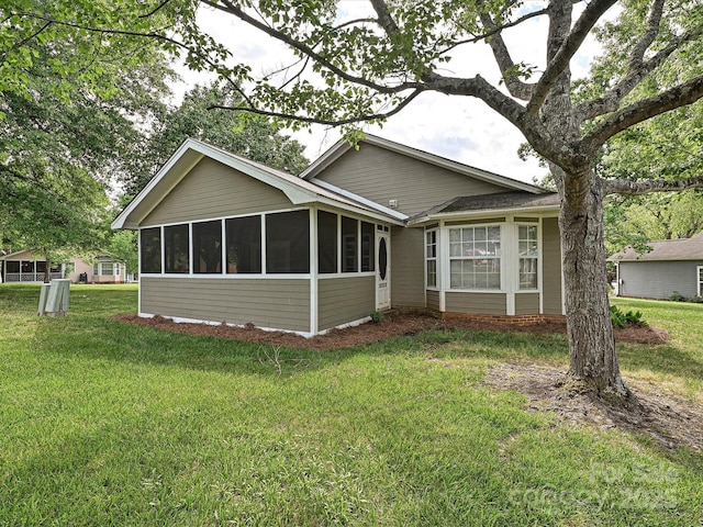 2919 Peachwood Ct, Fort Mill, SC 29715 - rear view of house with a sunroom and a yard