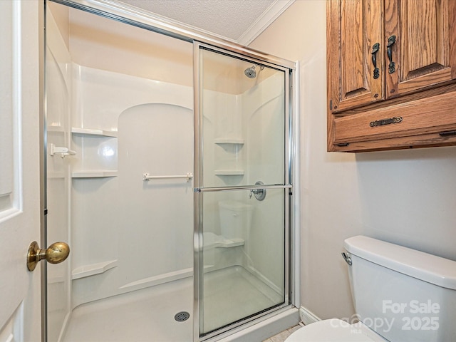 2919 Peachwood Ct, Fort Mill, SC 29715 - bathroom with a stall shower, toilet, crown molding, and a textured ceiling