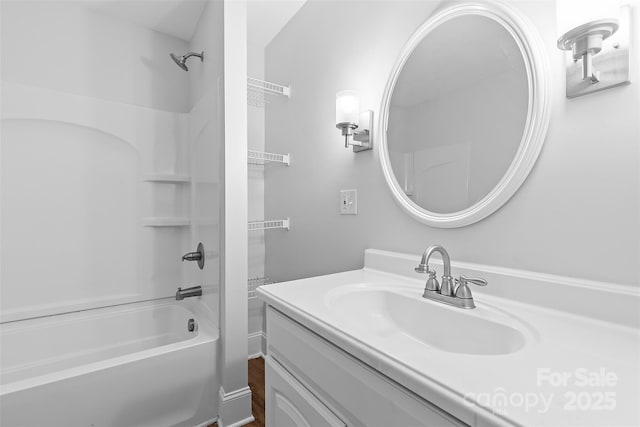 bathroom featuring vanity and washtub / shower combination