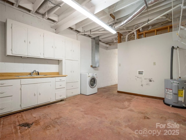 clothes washing area with water heater, cabinet space, washer / clothes dryer, and a sink
