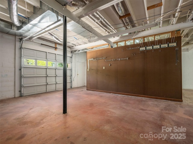 garage with concrete block wall