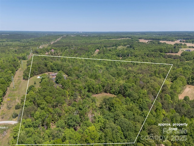 drone / aerial view with a forest view