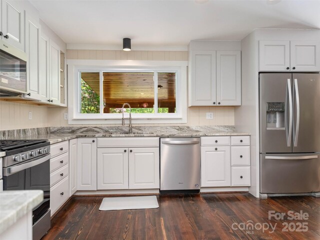 100 Ashton Ln, Brevard, NC 28712 - kitchen featuring stainless steel appliances, a sink, white cabinets, and light stone countertops