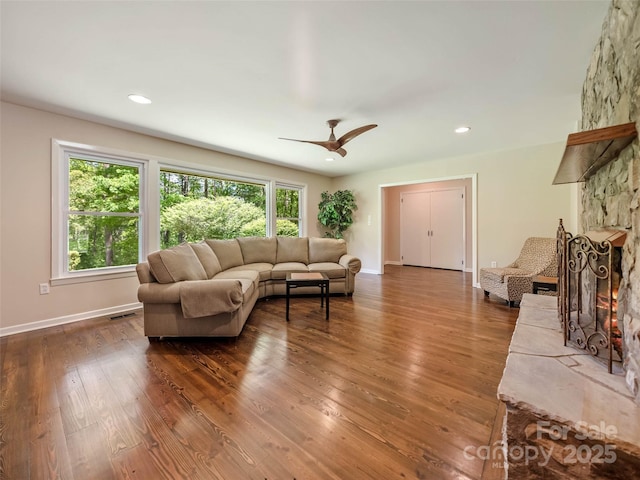 100 Ashton Ln, Brevard, NC 28712 - living area featuring a ceiling fan, dark wood-style flooring, baseboards, a stone fireplace, and recessed lighting