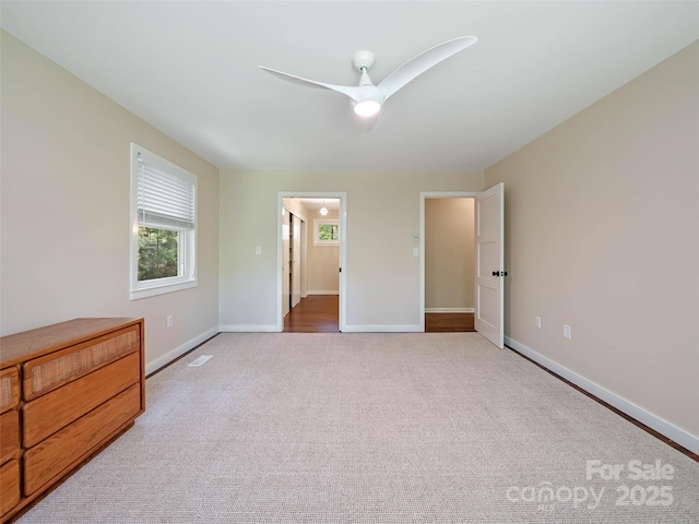 100 Ashton Ln, Brevard, NC 28712 - unfurnished bedroom with carpet floors, baseboards, and a ceiling fan
